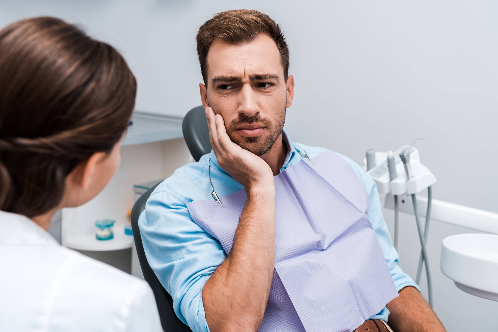 an expert in Short Pump Endodontics talking to a male patient