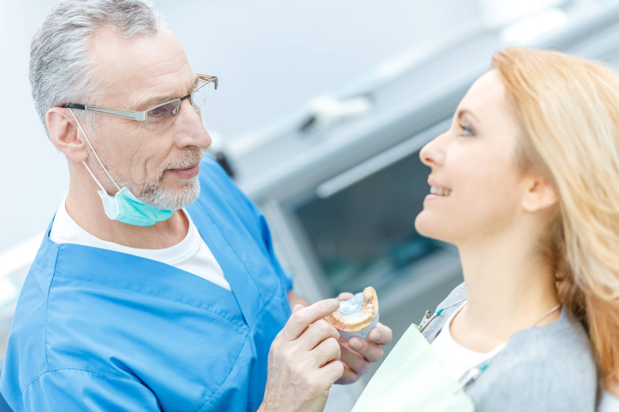 dentist discussing Endodontic Microsurgery in Midlothian