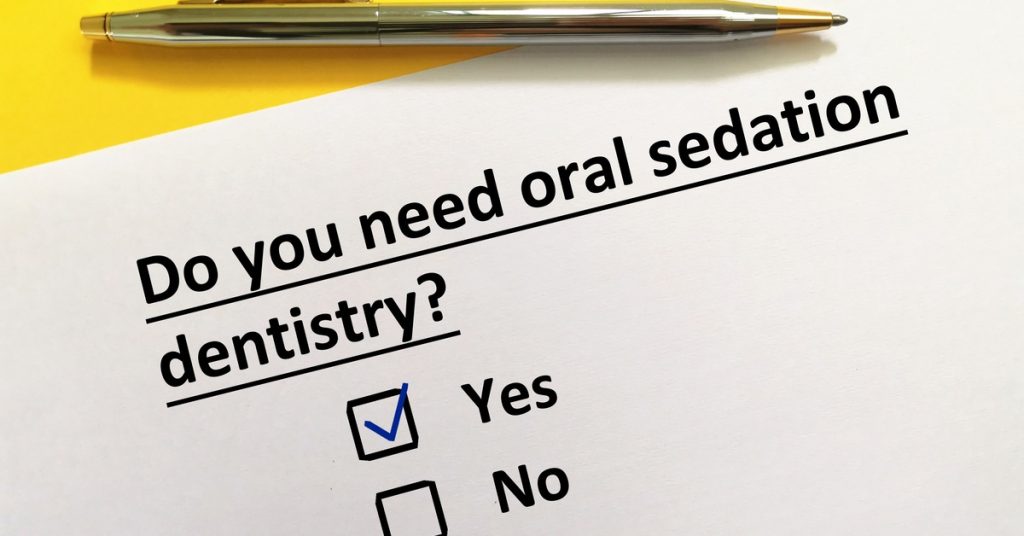 A printed questionnaire with the question “Do you need oral sedation dentistry?” and checkboxes for yes or no.